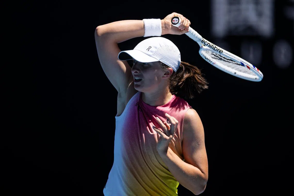 Jan 16, 2025; Melbourne, Victoria, Australia; Iga Swiatek of Poland hits a forehand during her match against Rebecca Sramkova of Slovakia in the second round of the women's singles at the 2025 Australian Open at Melbourne Park. Mandatory Credit: Mike Frey-Imagn Images