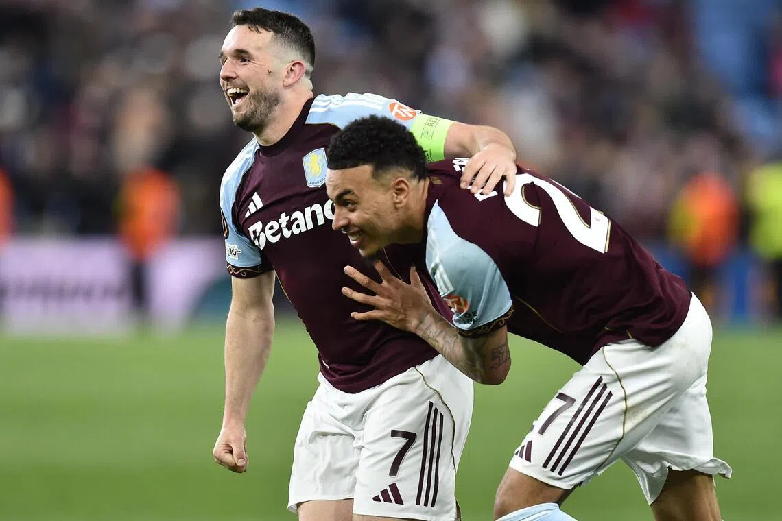 Aston Villa's John McGinn (left) and Morgan Rogers celebrate after winning their semi-final, 2nd leg match against Nottingham Forest on May 7.