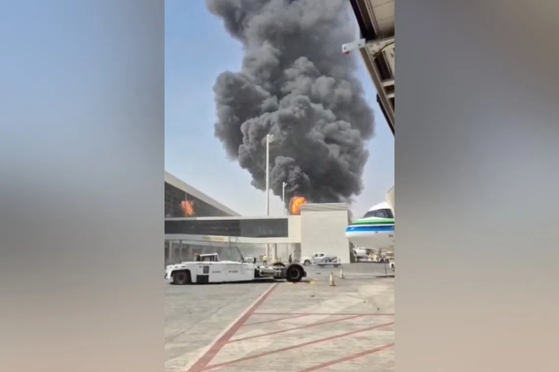 Smoke rise from Riyadh’s King Khalid Airport after strikes by Yemen’s Iran-backed Houthis on Oct 8.