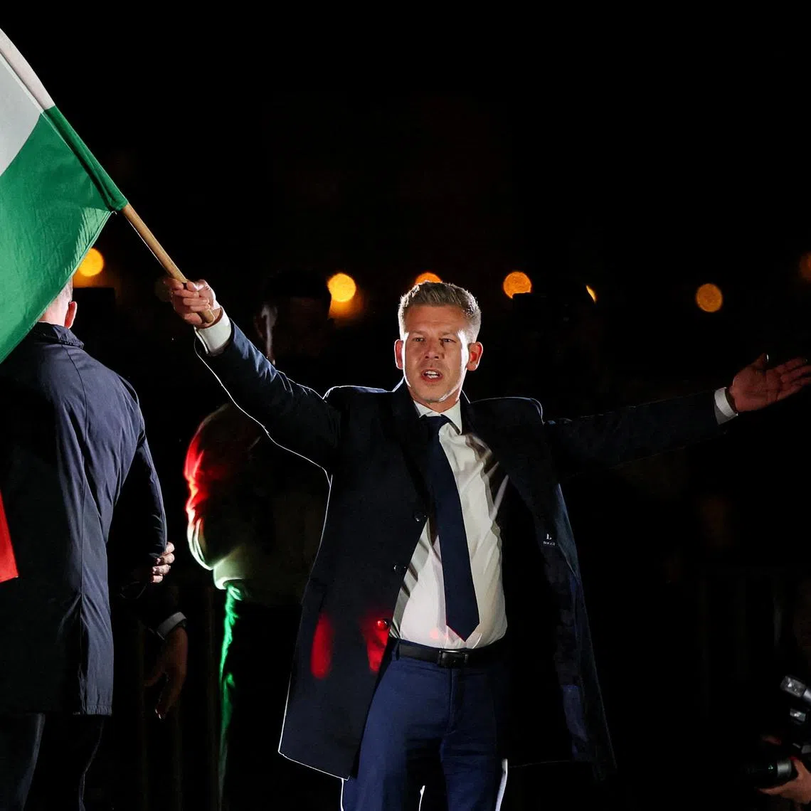 Leader of the Hungarian opposition Tisza party Peter Magyar celebrating the party's landslide victory.