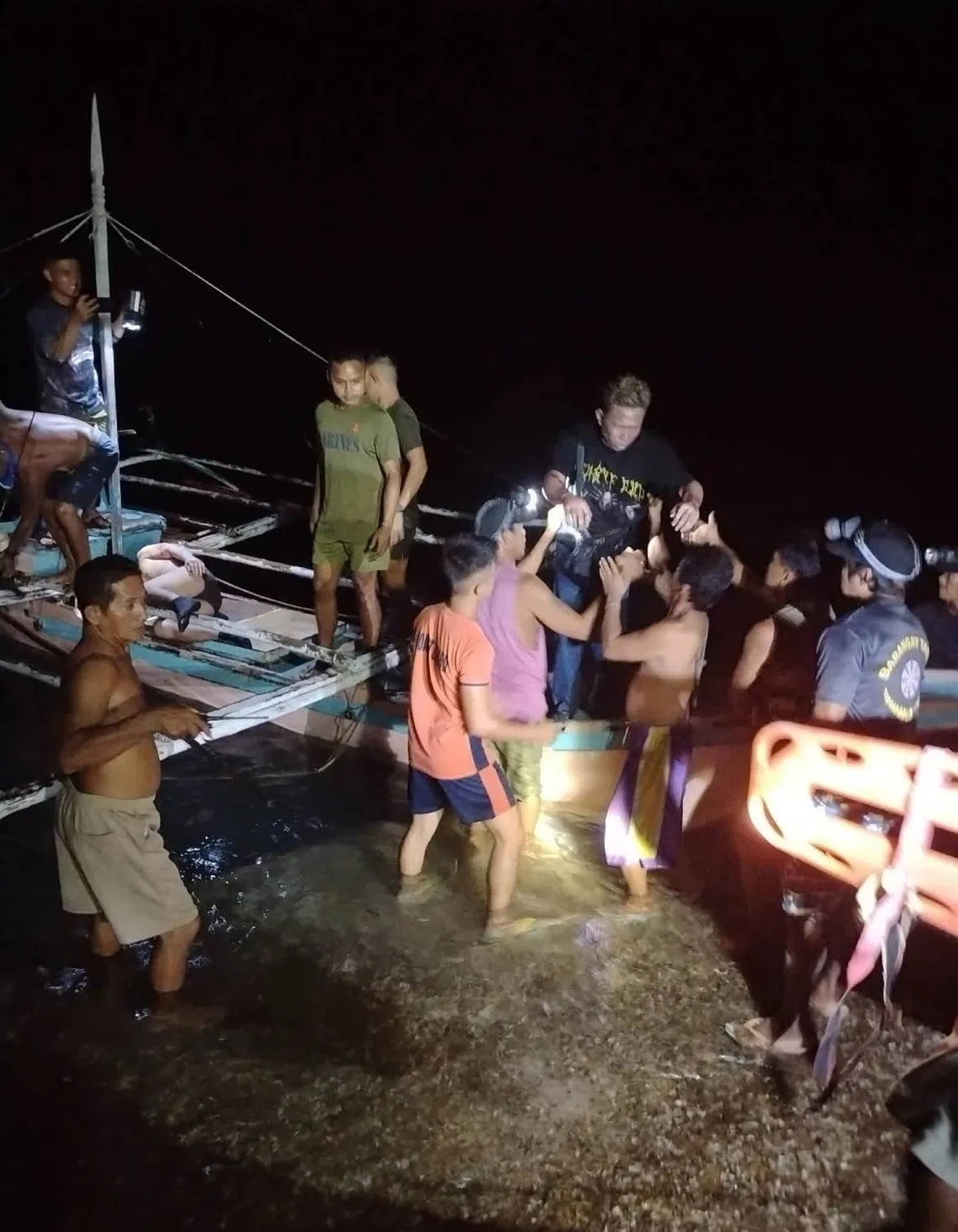 Survivors being rescued after evacuating from the burning ferry on Sept 9.