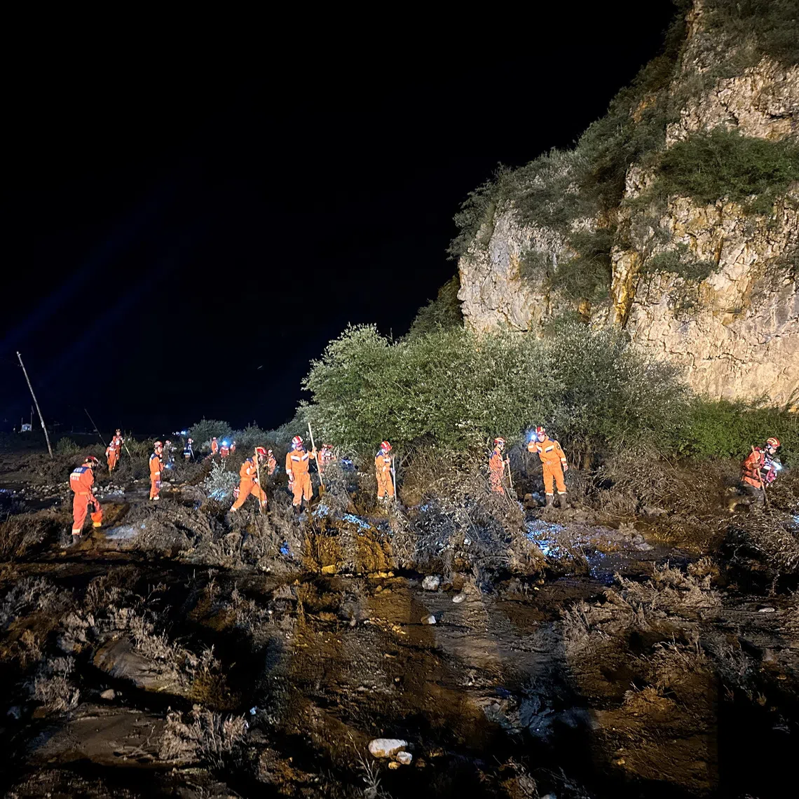 Rescue workers carry out search and rescue operations following flash floods at a scenic area in Weiyuan county, Dingxi city, Gansu province, China July 26, 2026. cnsphoto via REUTERS