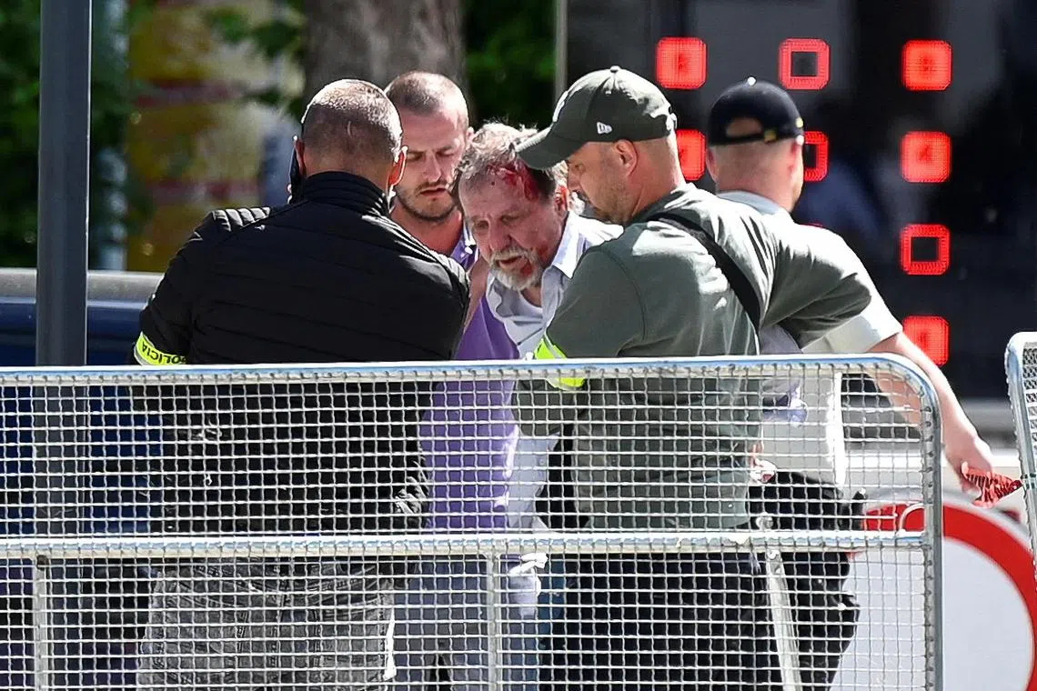 A person being detained at the scene, after the May 15 shooting of Slovak Prime Minister Robert Fico.
