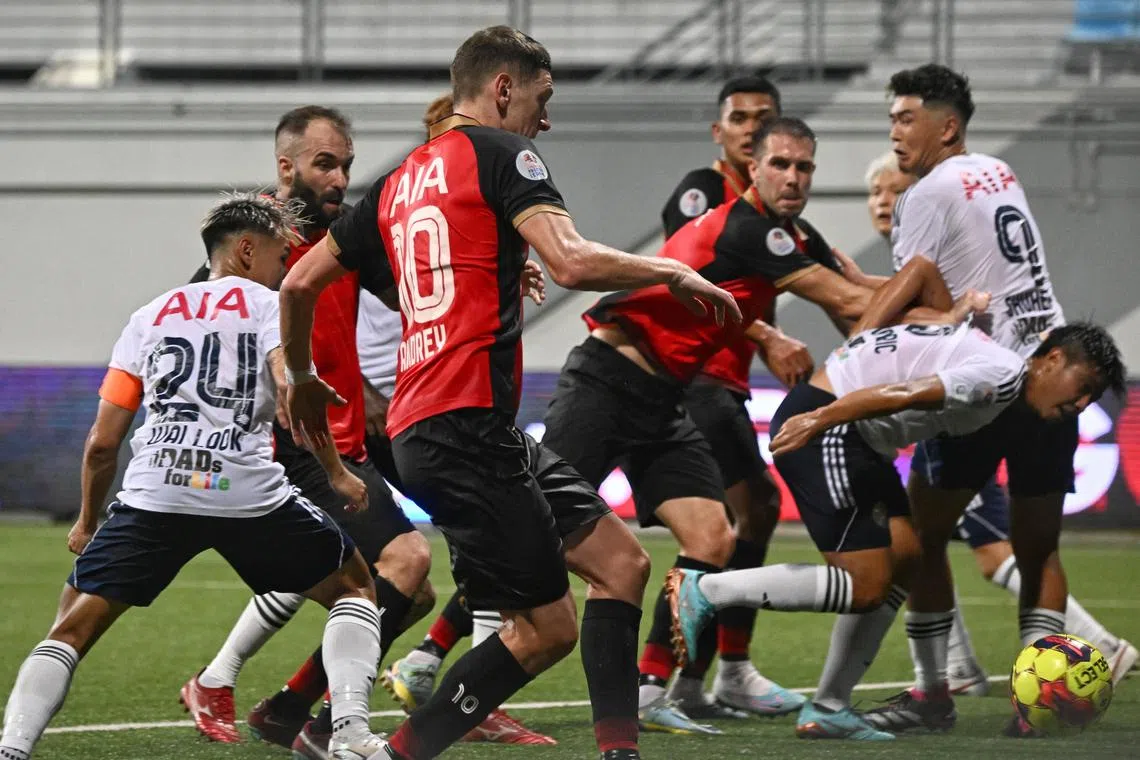 Players scramble for the ball during the Singapore Premier League match between Brunei DPMM and Balestier Khalsa at Jalan Besar Stadium on Mar 10, 2023.