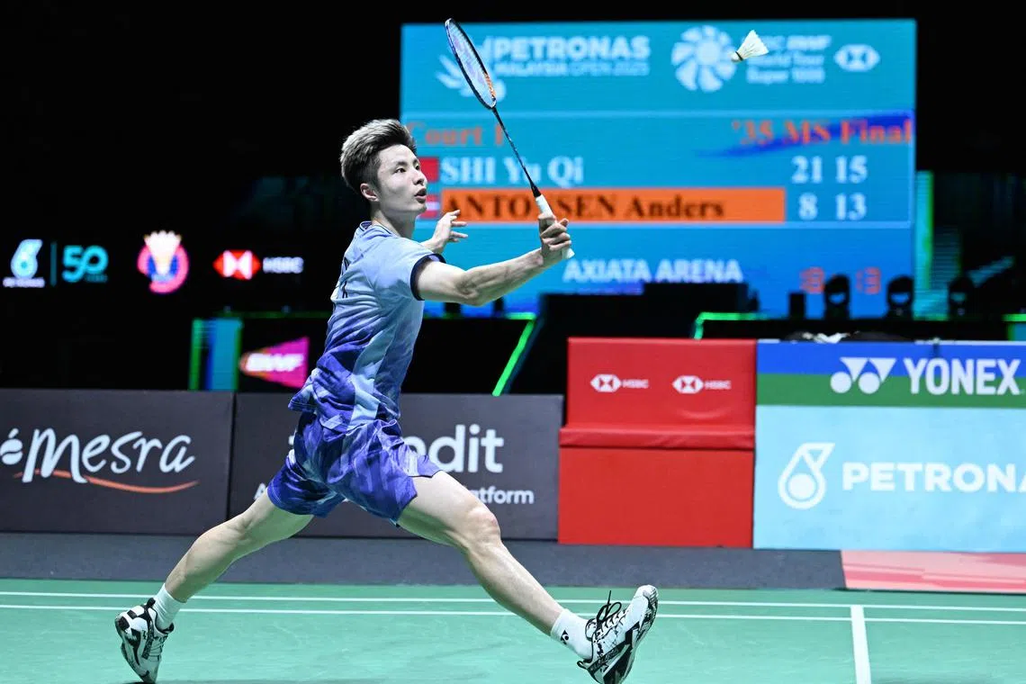 China's Shi Yu Qi hits a return against Denmark's Anders Antonsen during the men's singles final match at the Malaysia Open badminton tournament in Kuala Lumpur on January 12, 2025. (Photo by Mohd RASFAN / AFP)