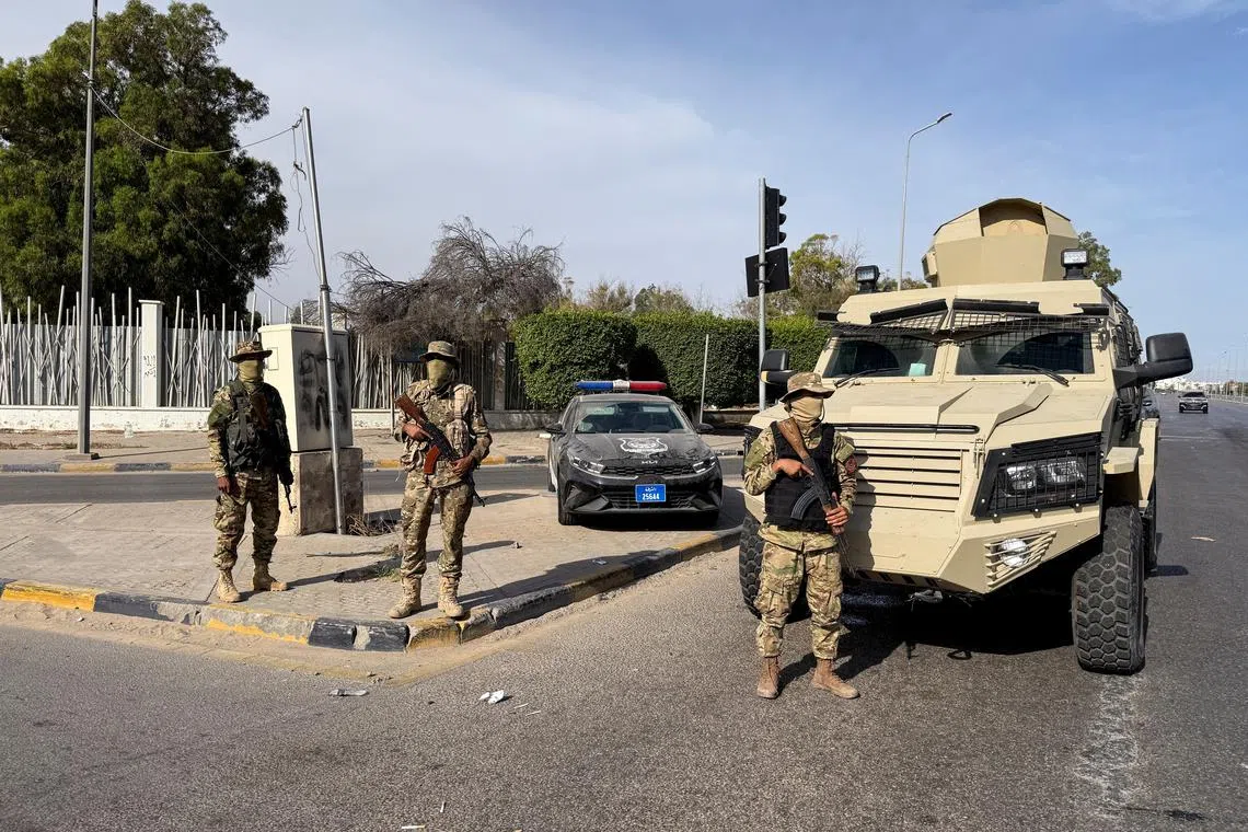 Members of the 444 Brigade of the Libyan Army, a unit serving the Government of National Unity (GNU) and Prime Minister Abdulhamid al-Dbeibah, stand guard at Abu Salim area, in Tripoli, Libya, May 13, 2025.  REUTERS/Ayman al-Sahili/File Photo