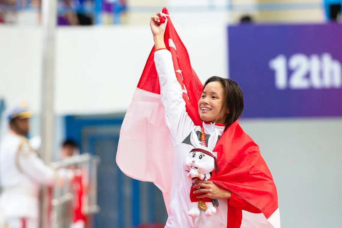 Singapore's Sophie Soon celebrates after winning gold in the women's SB12 100m breaststroke at the Asean Para Games on June 4, 2023.