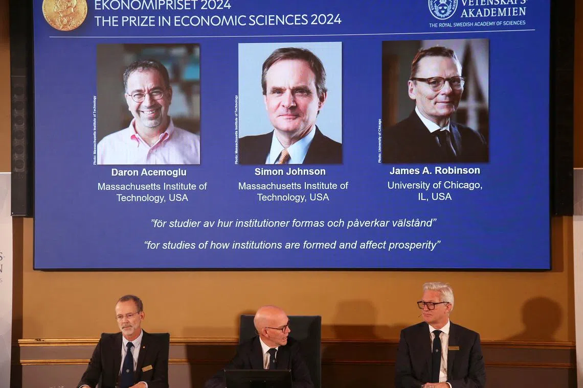(From left) US-based academics Daron Acemoglu, Simon Johnson and James Robinson won the 2024 Nobel economics prize.