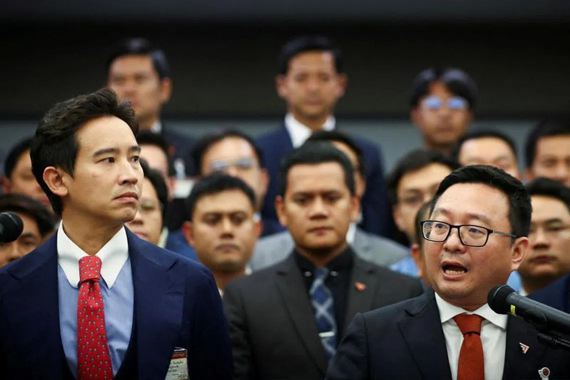 FILE PHOTO: Former Move Forward Party leader Pita Limjaroenrat and Move Forward Party leader Chaithawat Tulathon react during a presser after Thailand's Constitutional Court delivered its verdict on the election winner's bid to amend a law against insulting the monarchy, in Bangkok, Thailand, January 31, 2024. REUTERS/Chalinee Thirasupa/File Photo