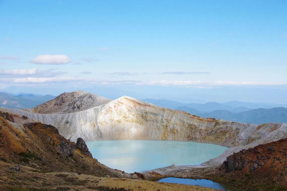 The emerald-green Yugama crater lake on Mount Kusatsu-Shirane, which straddles Gunma and Nagano prefectures.