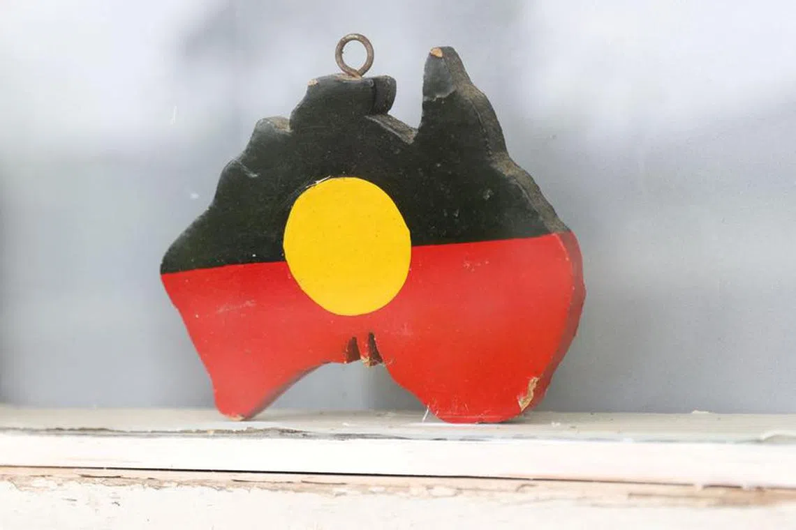 FILE PHOTO: A depiction of the Australian Aboriginal Flag is seen on a window sill at the home of indigenous Muruwari elder Rita Wright, a member of the \"Stolen Generations\", in Sydney, Australia, January 19, 2021..  REUTERS/Loren Elliott/File Photo