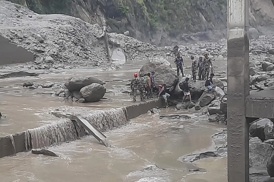 Nepalese soldiers during a rescue operation in the flood-affected area of Rasuwagadhi in Nepal on July 8, 2025.  