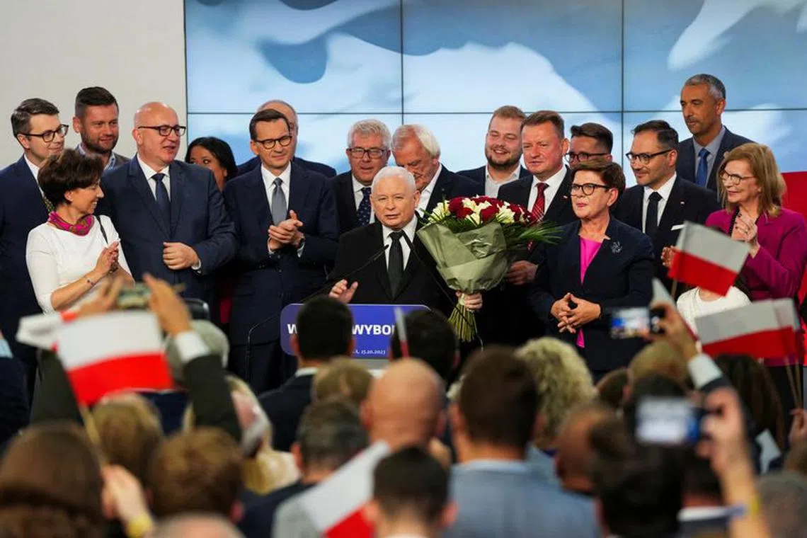 Leader of Poland's ruling conservative Law and Justice (PiS) party Jaroslaw Kaczynski, holds flowers during a speech after the exit poll results are announced in Warsaw, Poland, October 15, 2023. REUTERS/Aleksandra Szmigiel