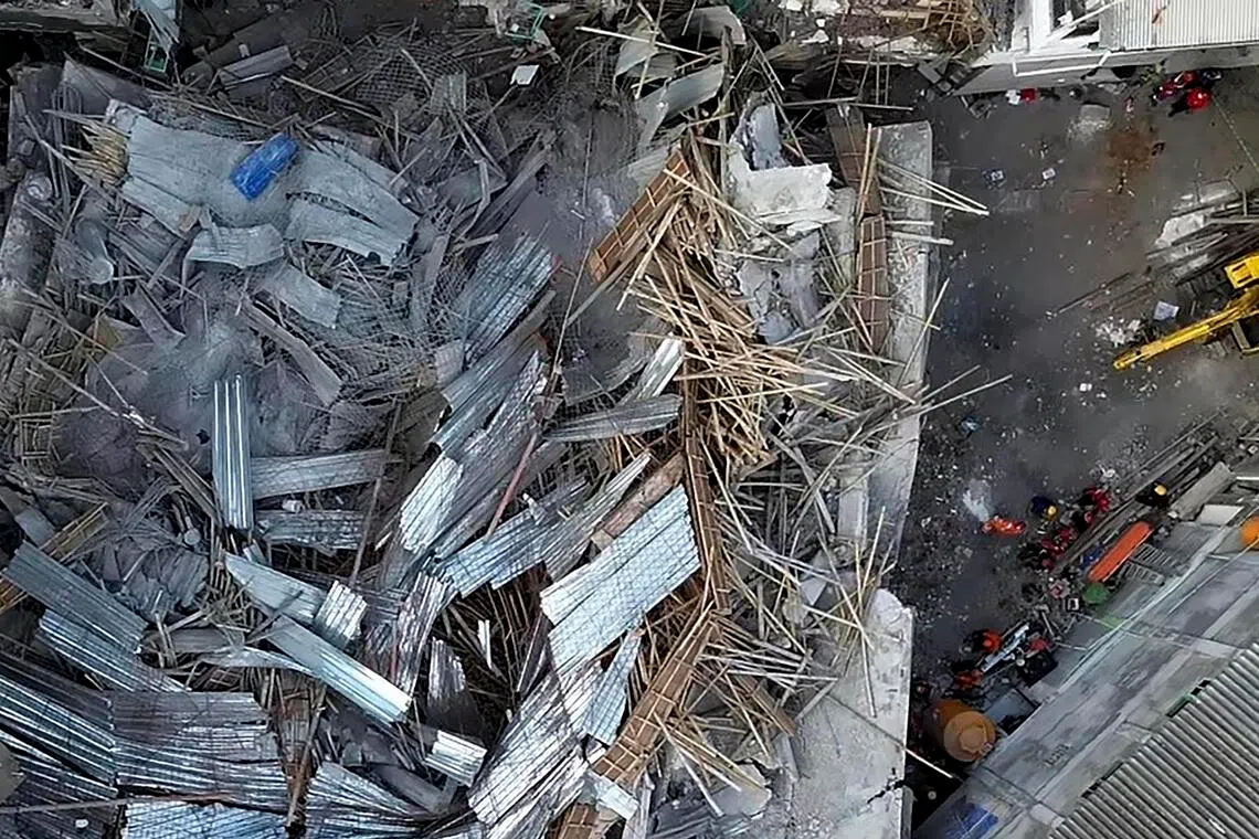 An aerial view shows the collapsed building at an Islamic boarding school in Sidoarjo, East Java, in Indonesia on Oct 1. 