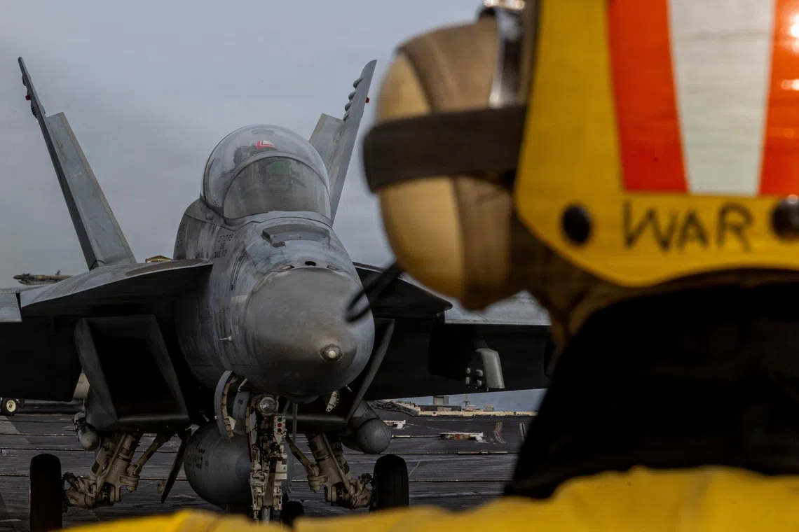 An F/A-18F Super Hornet preparing to launch from the flight deck of the US Navy Nimitz-class aircraft carrier USS Abraham Lincoln on March 31.