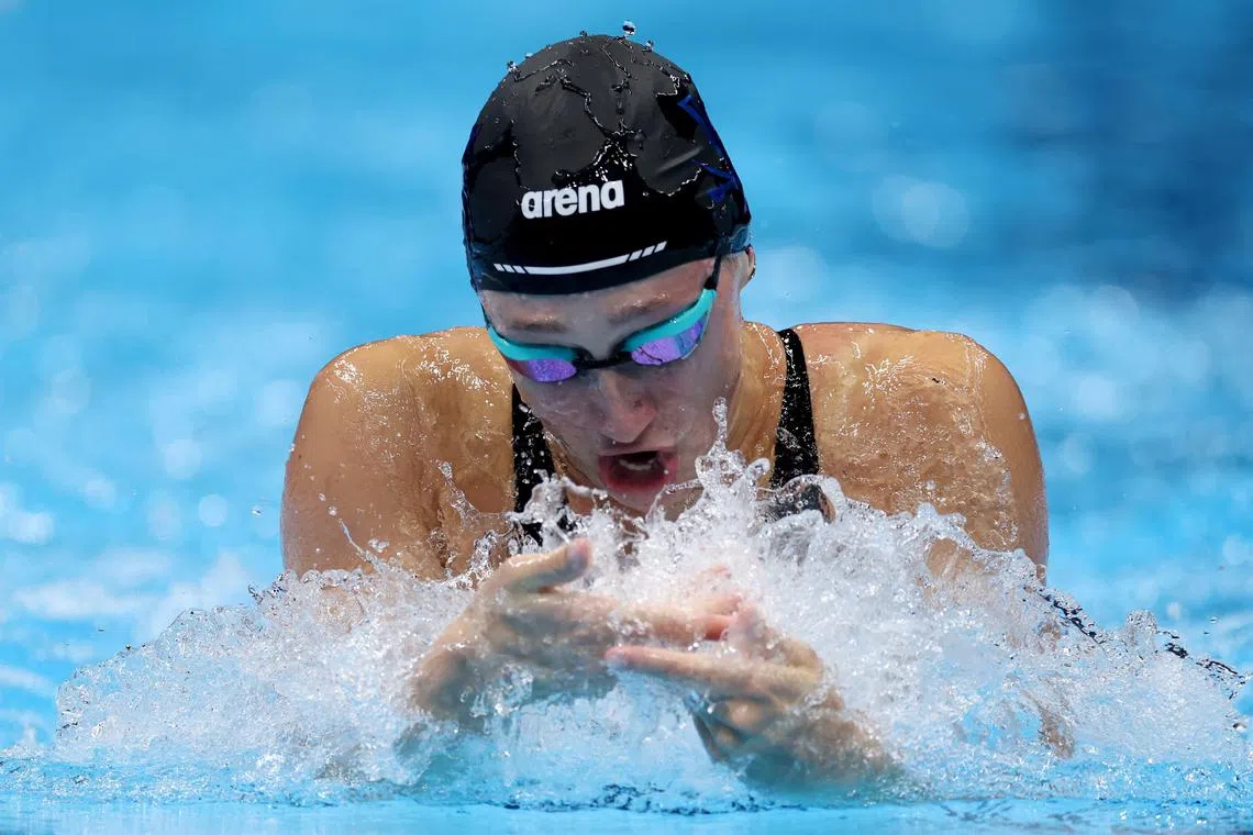 A lifeguard was called upon to retrieve American swimmer Emma Weber's swim cap after her 100m breaststroke heat.
