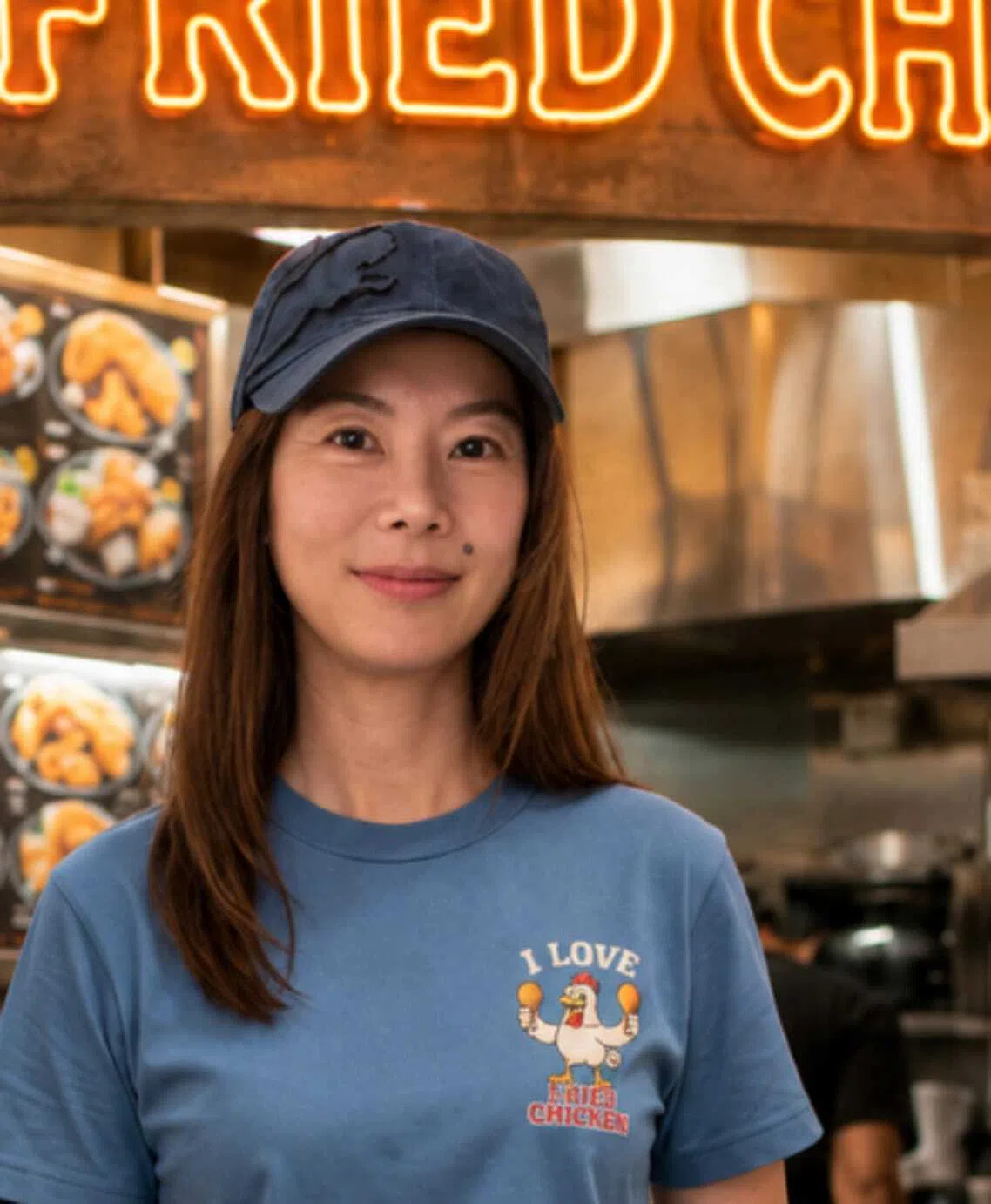 Cherie Lim plays nosy fried chicken rice stall owner Bing Bing, the “ji po” (Chinese for busybody) in the coffee shop, in BingBingBiangBiang Kopidiam.