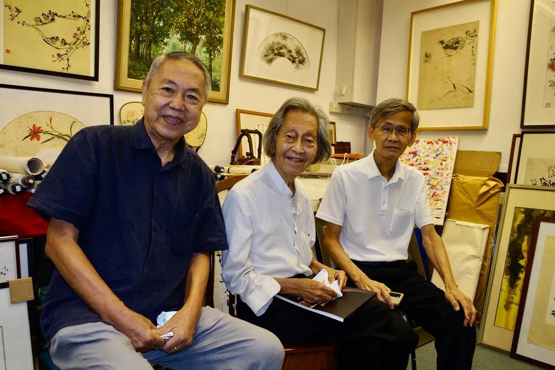 Artist-curator Choy Weng Yang (middle) with arts writer Teo Han Wue (left) and former National Library director of policy integration and research Lai Yeen Pong at Nanyang Gallery in Bras Basah Complex. 