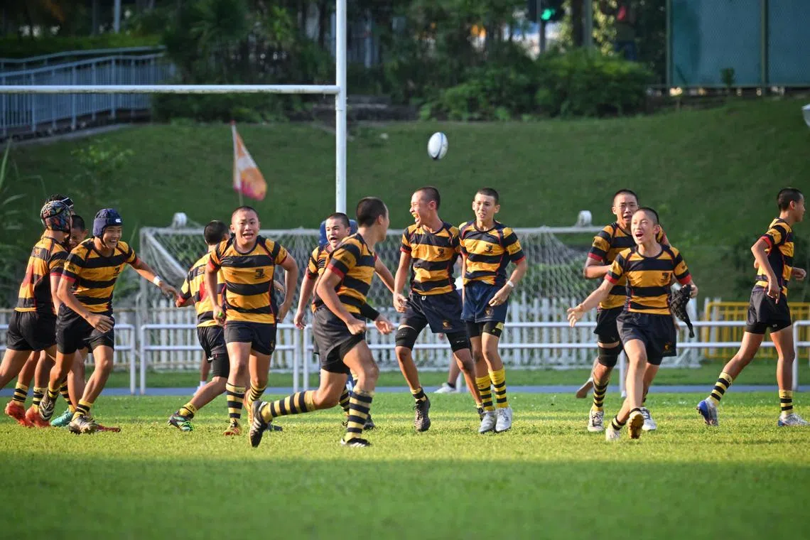 Anglo-Chinese School (Independent) celebrate after St Andrew's Secondary School's Wesley Choo, 13, fired his conversion attempt wide to hand ACS(I) a 36-34 victory in the C Division boys' final.