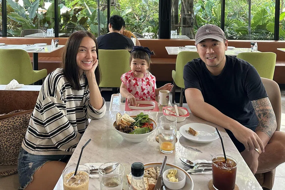 Ase Wang with her daughter Kaya and entrepreneur husband Jonathan Lor, out on a weekend in Bangkok.
