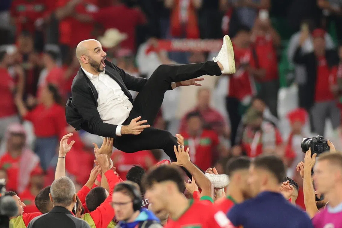 Head coach Walid Regragui of Morocco celebrates after winning the FIFA World Cup 2022 round of 16 soccer match between Morocco and Spain at Education City Stadium in Doha, Qatar, Dec 6, 2022. 