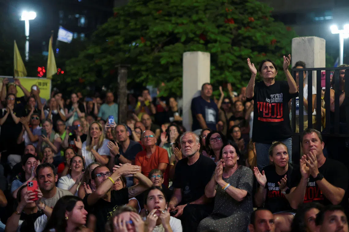 People gather in \"Hostages square\", after a ceasefire between Israel and Hamas in Gaza went into effect, in Tel Aviv, Israel, October 11, 2025. REUTERS/Hannah McKay