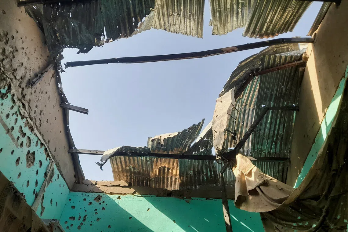 A ceiling damaged by shelling shrapnel at a displaced persons center in El Fasher, Sudan, October 7, 2025. REUTERS/Mohyaldeen M Abdallah