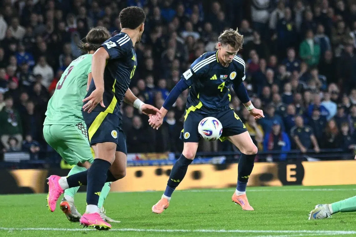 Scotland midfielder Scott McTominay controls the ball before scoring their second goal during the 2026 World Cup Group C qualifier against Belarus.