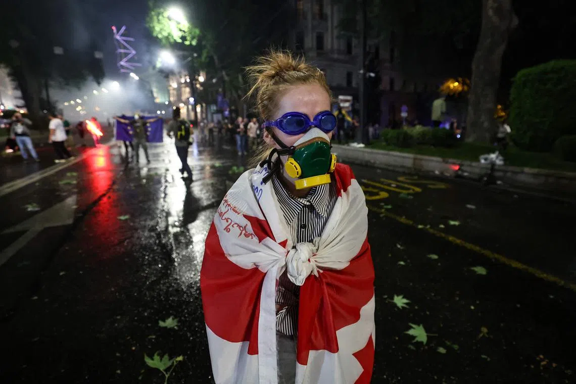 Protesters facing off against law enforcement officers near the Georgian parliament in Tbilisi, on April 30, 2024.