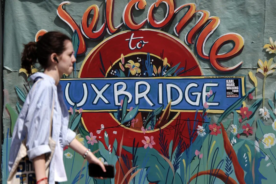 epa10757507 A pedestrian walks past a 'Welcome to Uxbridge' sign outside Uxbridge Station on the day of the by-election for Britain's parliamentary constituency of Uxbridge, in Uxbridge, west London, Britain, 20 July 2023. Polls opened on 20 July in by-elections for Somerton and Frome, west London suburbs Uxbridge and South Ruislip, as well as Selby and Ainsty in North Yorkshire.  EPA-EFE/ANDY RAIN