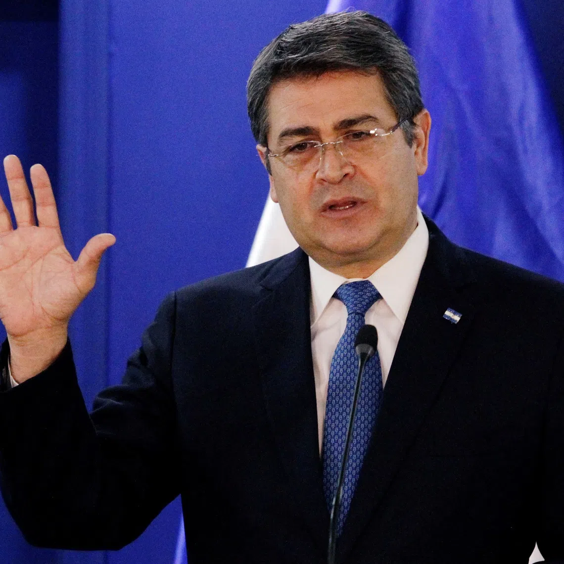 FILE PHOTO: Honduras' President Juan Orlando Hernandez speaks during a joint message with U.S. Department of Homeland Security (DHS) acting Secretary Chad Wolf (not pictured), at the Presidential House in Tegucigalpa, Honduras January 9, 2020. REUTERS/Jorge Cabrera/File Photo