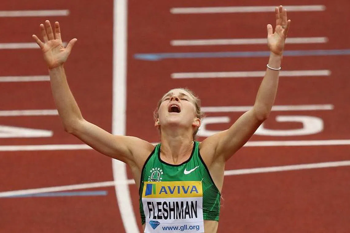 FILE PHOTO: Athletics - Samsung Diamond League 2011 - Aviva London Grand Prix - Crystal Palace, London - 6/8/11   USA's Lauren Fleshman celebrates winning the women's 5000m   Mandatory Credit: Action Images / Peter Cziborra