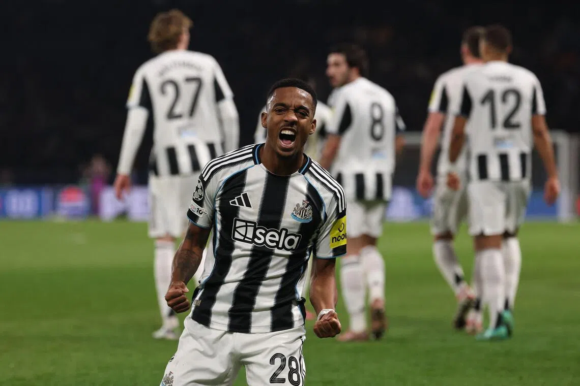 Newcastle United's Joe Willock celebrates scoring the 1-1 equaliser against Paris Saint-Germain.