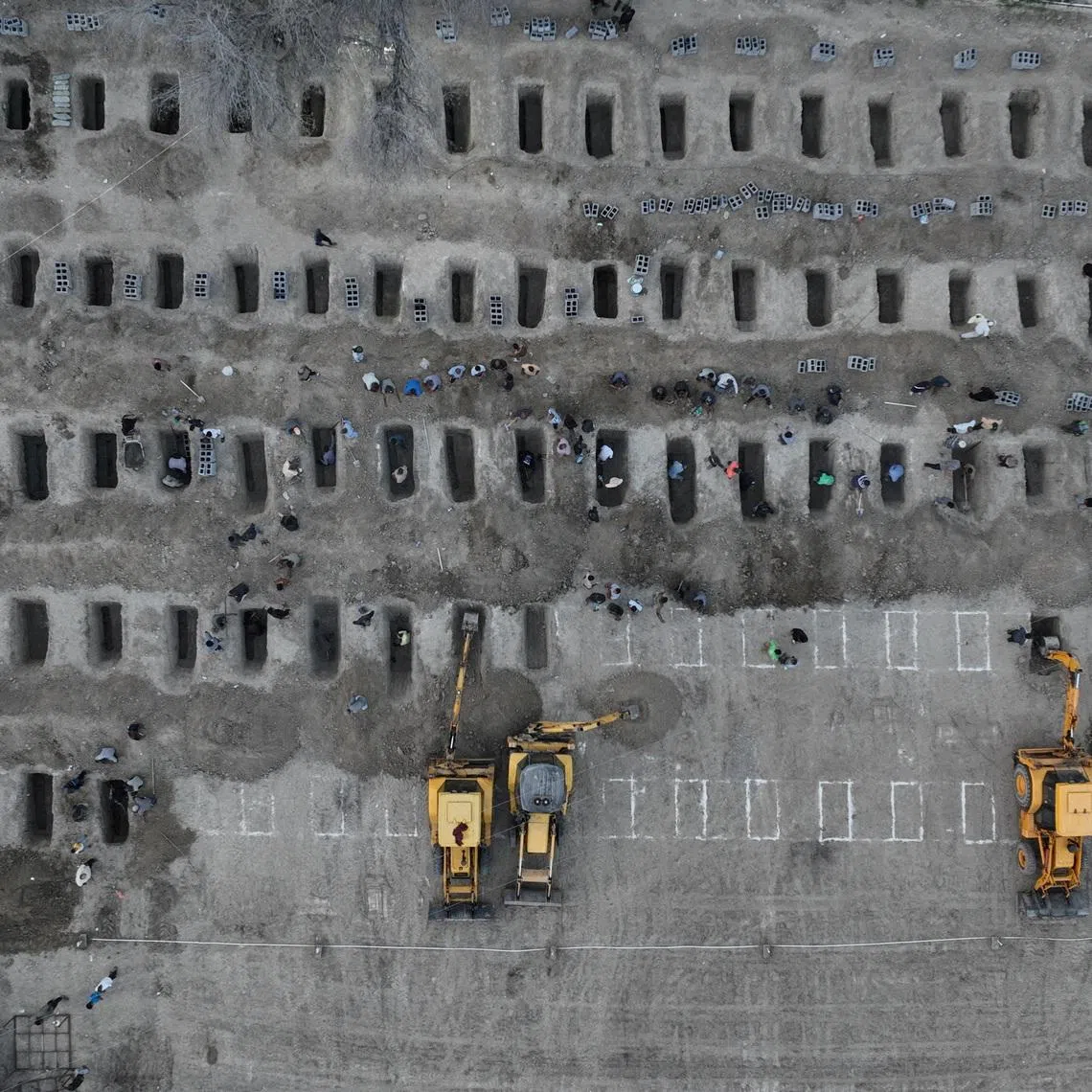 FILE PHOTO: Graves are being prepared for the victims following a reported strike on a school in Minab, Iran, March 2, 2026. Iranian Foreign Media Department/WANA (West Asia News Agency)/Handout via REUTERS/File Photo