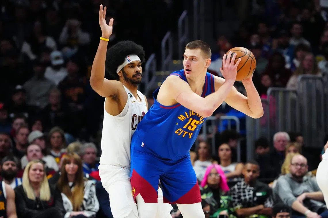 Nikola Jokic (right) had 28 points, 15 rebounds and 10 assists for his 10th triple-double of the NBA season.