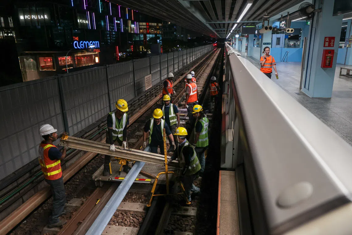 Technicians performing repairs at Clementi MRT station on Sept 27, 2024, after an axle bearing failure caused a six-day disruption on the East-West Line.