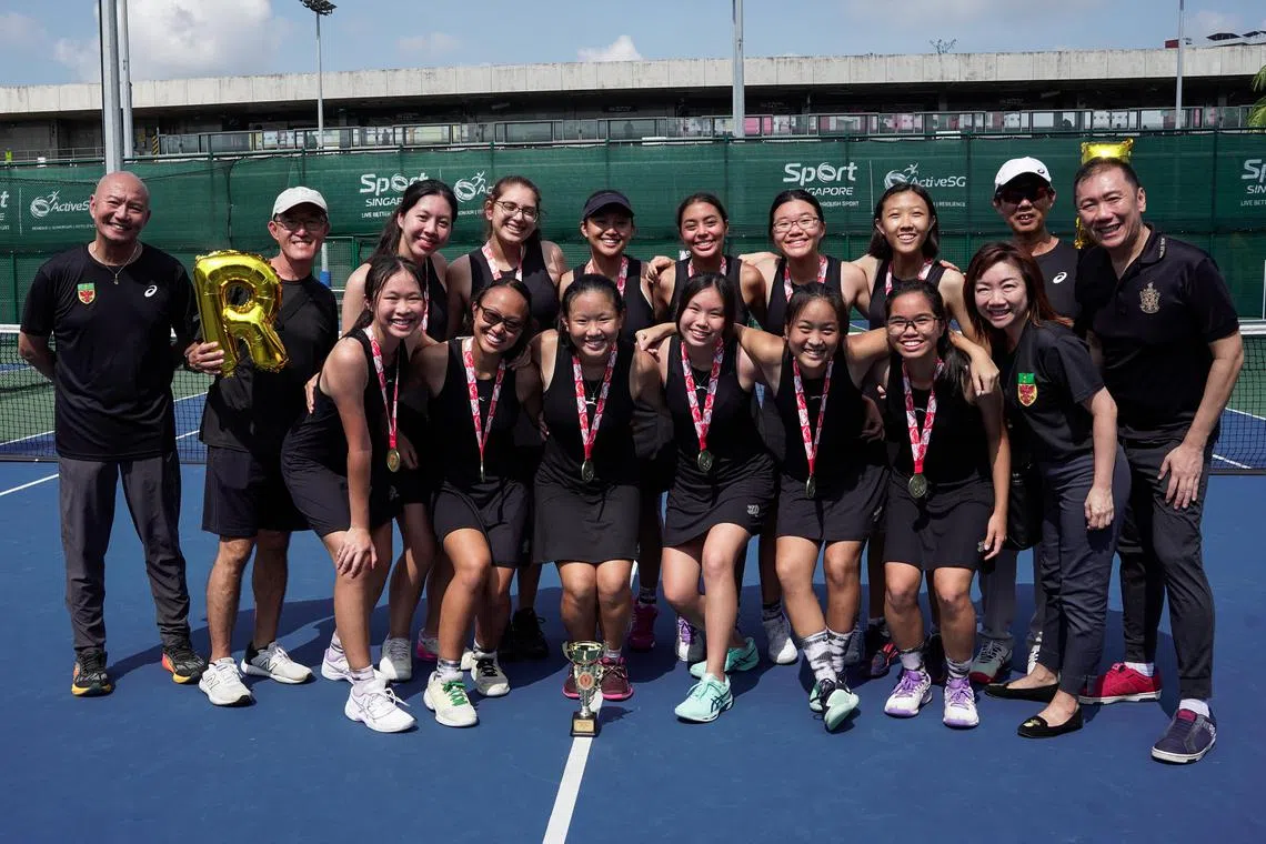 Raffles Institution posing for a photo with their first place medals after the A Division girls' tennis final on May 11, 2023.

ST PHOTO: EUGENE TAN