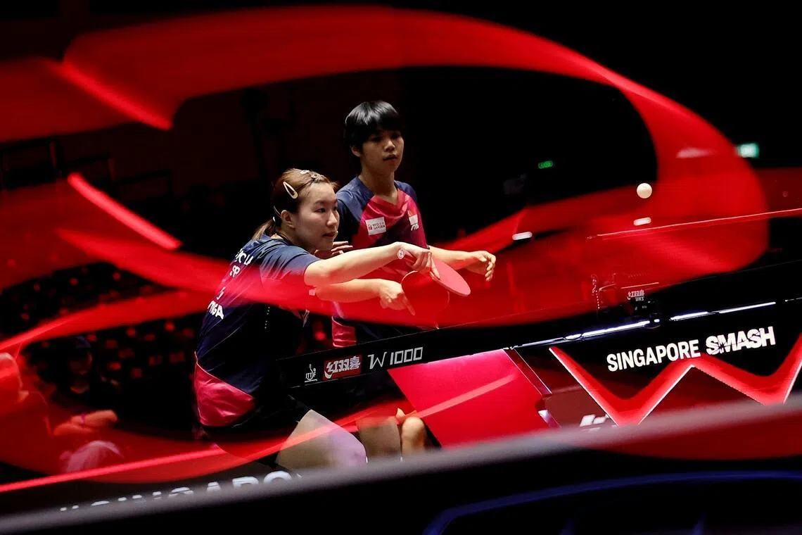 Chloe Lai (left) and Loy Ming Ying of Singapore in action against Hina Hayata and Miwa Harimoto of Japan in the women's doubles quarter-finals at Singapore Smash on Feb 25. 