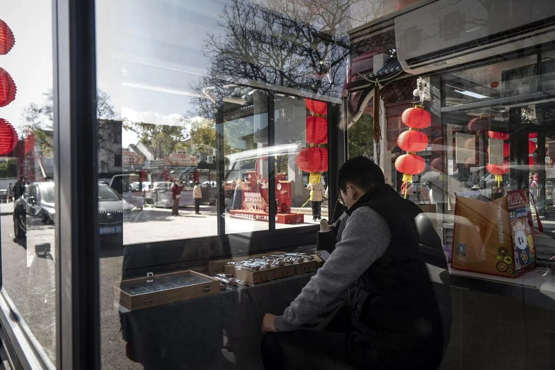 A Covid testing booth transformed into a souvenir stall in Suzhou, Jiangsu province, China, on Wednesday, Jan. 25, 2023. In 2022, tens of thousands of testing booths were erected across China's largest and most economically vital cities, with the goal of having residents always just a 15-minute walk away from a swabbing point. With the abrupt end of Covid Zero in December, cities are left with the problem of what to do with these modular buildings. Photographer: Qilai Shen/Bloomberg
