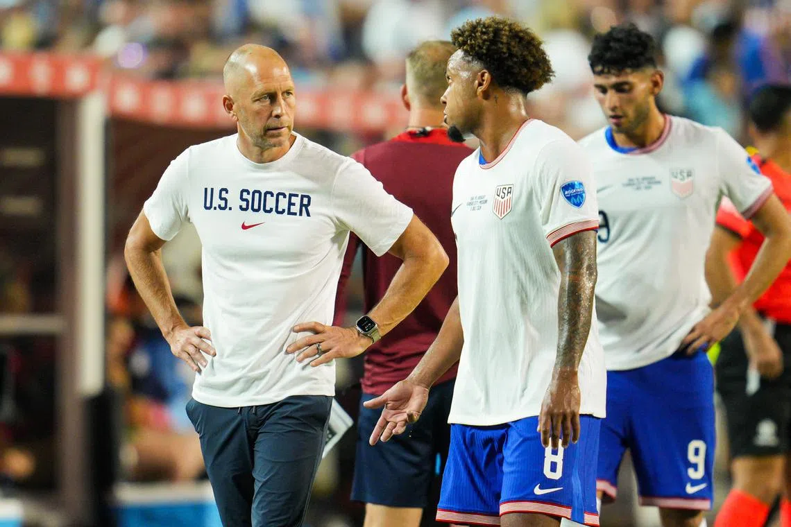 Jul 1, 2024; Kansas City, Missouri, USA; United States head coach Gregg Berhalter talks with midfielder Weston McKennie (8) during the second half of a Copa America match against Uruguay at Arrowhead Stadium. Mandatory Credit: Jay Biggerstaff-USA TODAY Sports