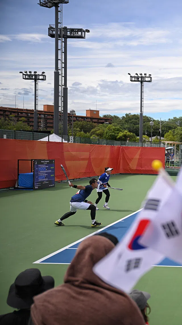 Kim Hyunsoo (left) and Lee Sujin (right) of South Korea in action against Noelle Manalac and Samuel Nuguit of the Philippines during the Soft Tennis Mixed Doubles group match held at Higashiyama Park Tennis Center on Sept 21, 2026.