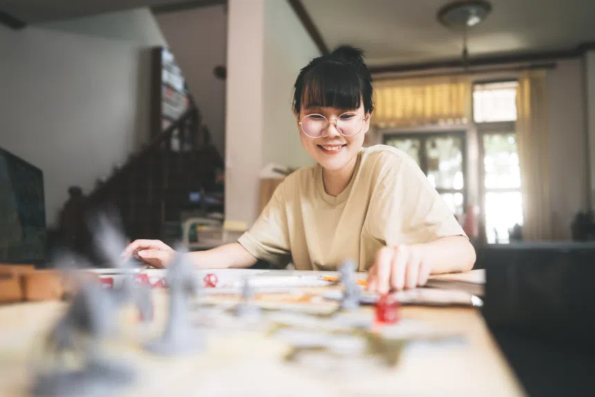 Woman playing dungeon and dragons one of the best boardgames for adults