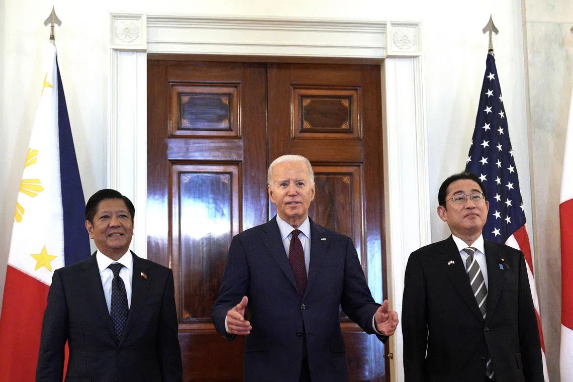 President Joe Biden, center, with Philippine President Ferdinand R. Marcos Jr., left, and Japanese Prime Minister Fumio Kishida before a trilateral meeting at the White House in Washington on Thursday, April 11, 2024. Biden intends to use a first-ever joint meeting with the leaders of Japan and the Philippines to send a blunt diplomatic message to an increasingly aggressive China: BeijingÕs harassment of Philippine ships in the South China Sea is a violation of international law and must stop. (Yuri Gripas/The New York Times)