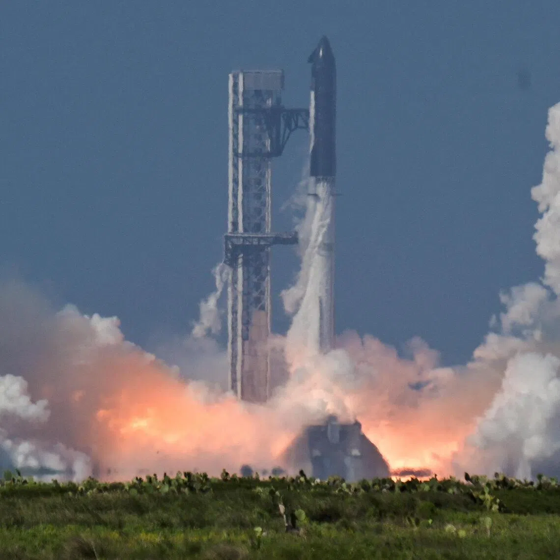 A SpaceX Super Heavy booster carrying the Starship spacecraft lifts off on its 12th test flight at Starbase, Texas, on May 22.