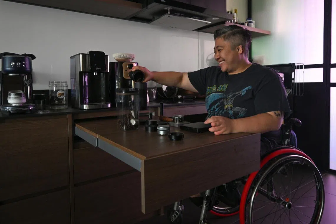 Singaporean para-swimmer Theresa Goh making coffee on a retractable table.