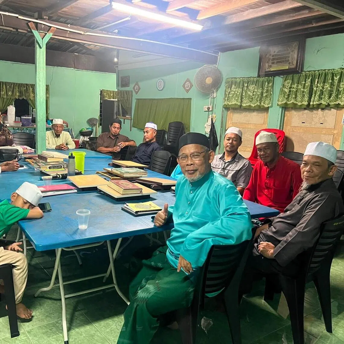 Perak’s PAS MP Misbahul Munir (in turquoise) leads an usrah or ‘family gathering’ on Jul 21.