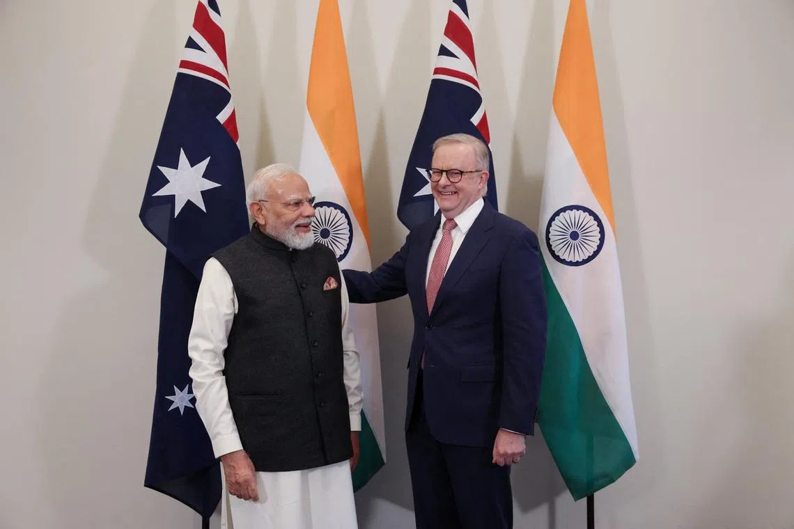 Australian Prime Minister Anthony Albanese and Indian Prime Minister Narendra Modi react ahead of the CEO Forum and Economic Roadmap Business Reception in Melbourne, Australia, July 9, 2026.  REUTERS/Hollie Adams