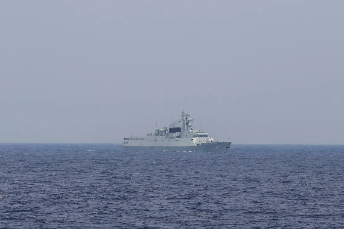 FILE PHOTO: A Chinese navy ship is seen sailing in the South China Sea, October 4, 2023. REUTERS/Adrian Portugal/File Photo