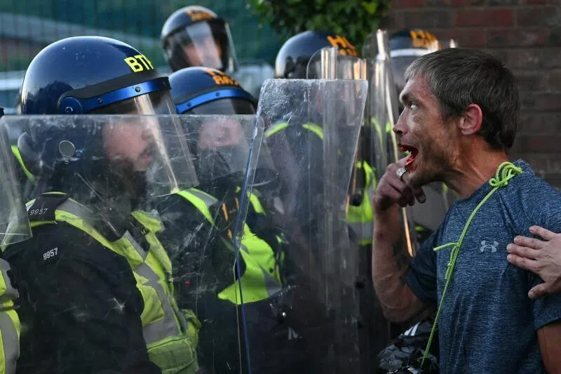 A demonstrator reacting after kicking a police wall on June 2 near Portswood Police Station, following a protest march in Southampton, southern England.