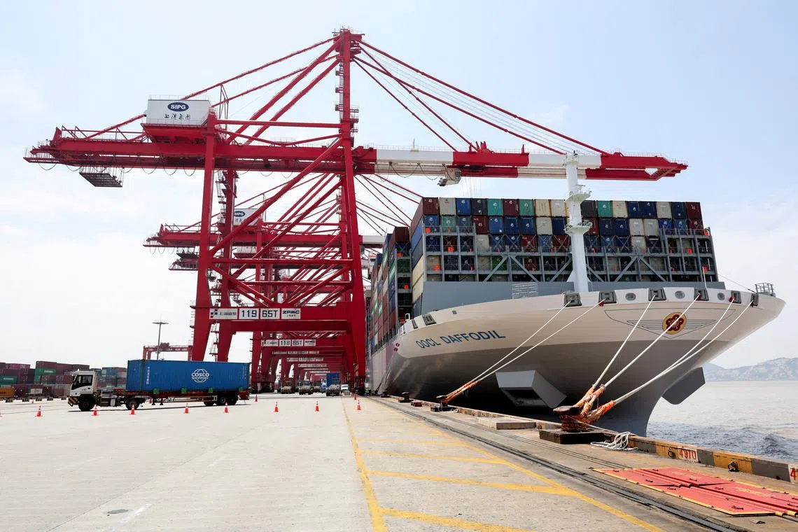 FILE PHOTO: A container ship OOCL Daffodil is docked at Yangshan Port outside of Shanghai, China, June 17, 2025. REUTERS/Go Nakamura/File Photo